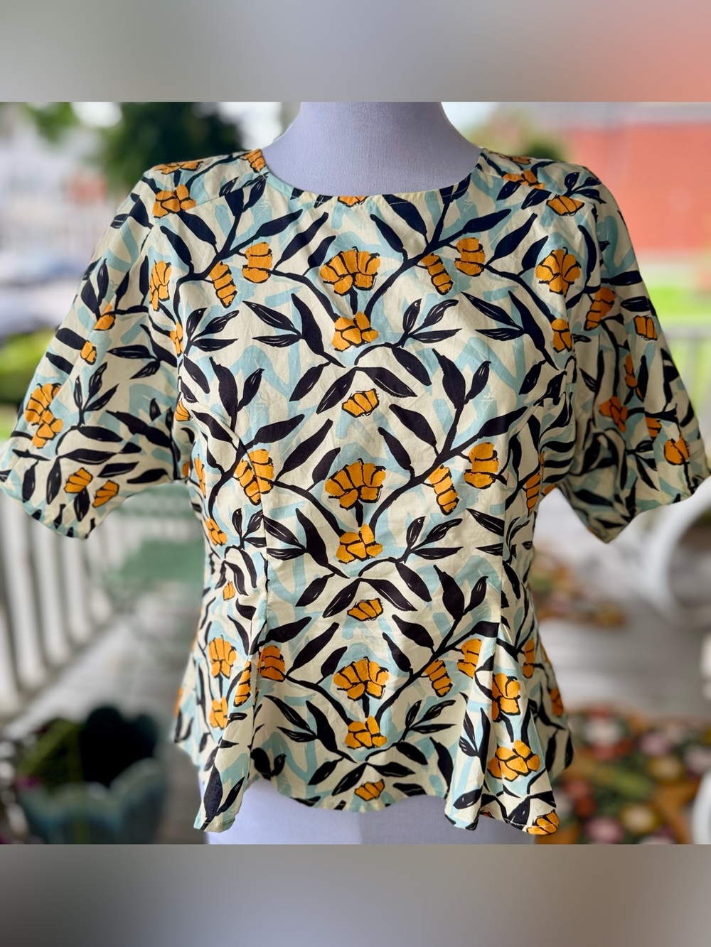 MELLODAY Floral Peplum Top in Yellow & Cream with Black Leaves